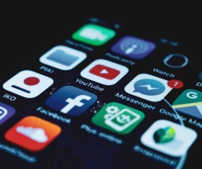 Business comparing organic social media and paid social advertising strategies